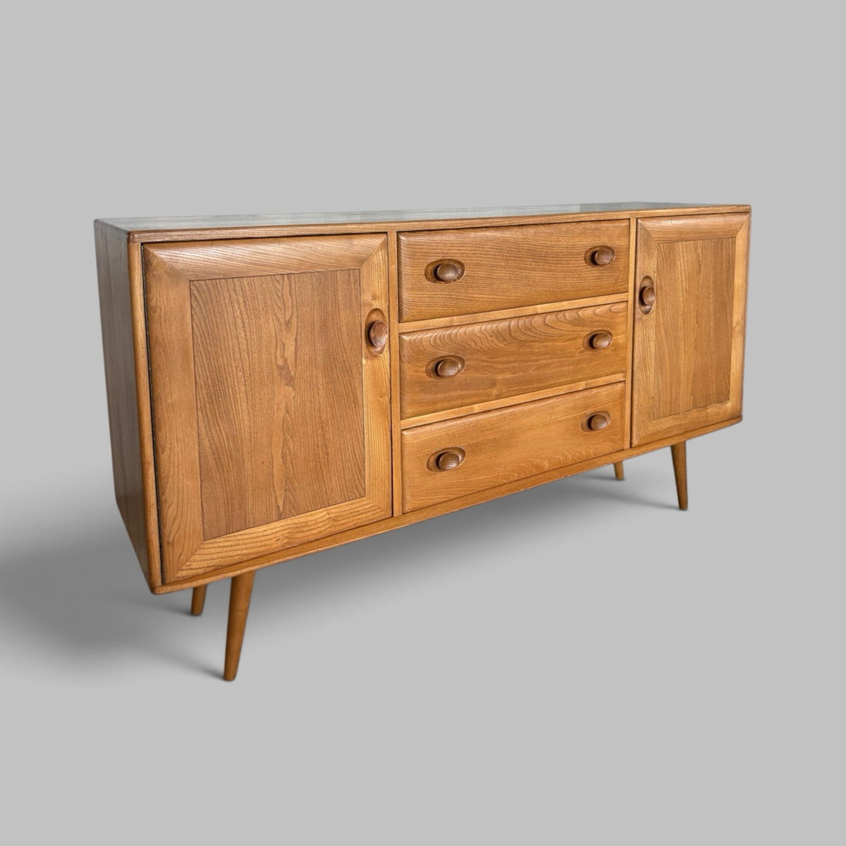 Vintage Ercol Solid Elm Windsor Sideboard on tapered legs.