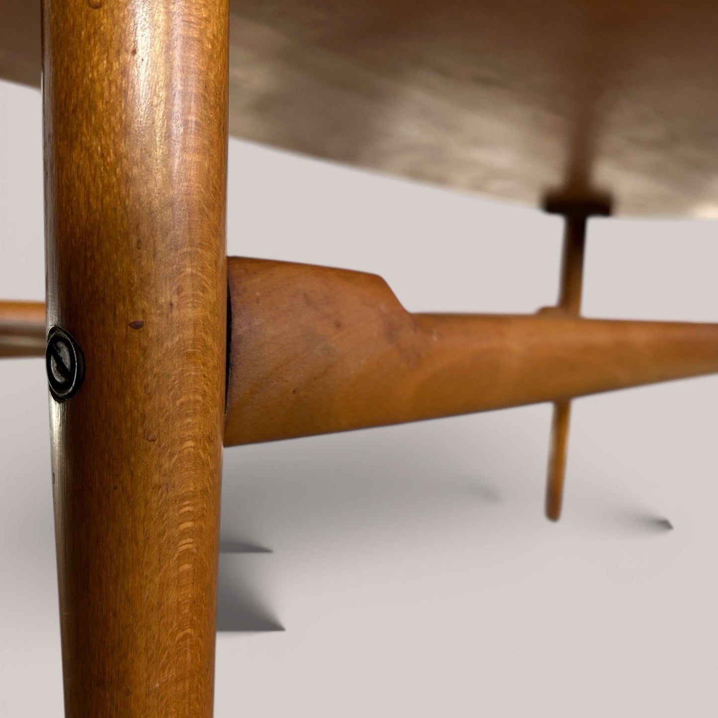 Mid-century teak coffee table with slatted magazine shelf