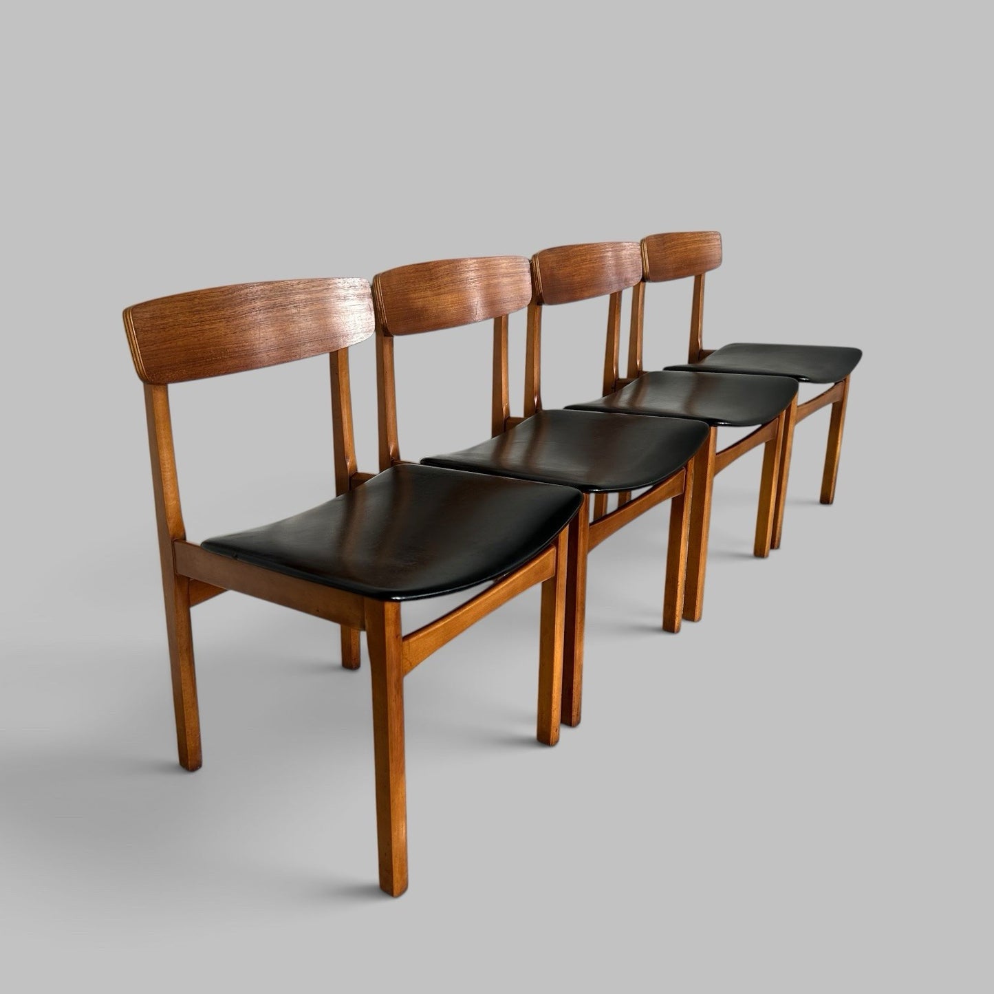 Vintage Teak Dining Chairs with Black Vinyl Seats – Set of Four