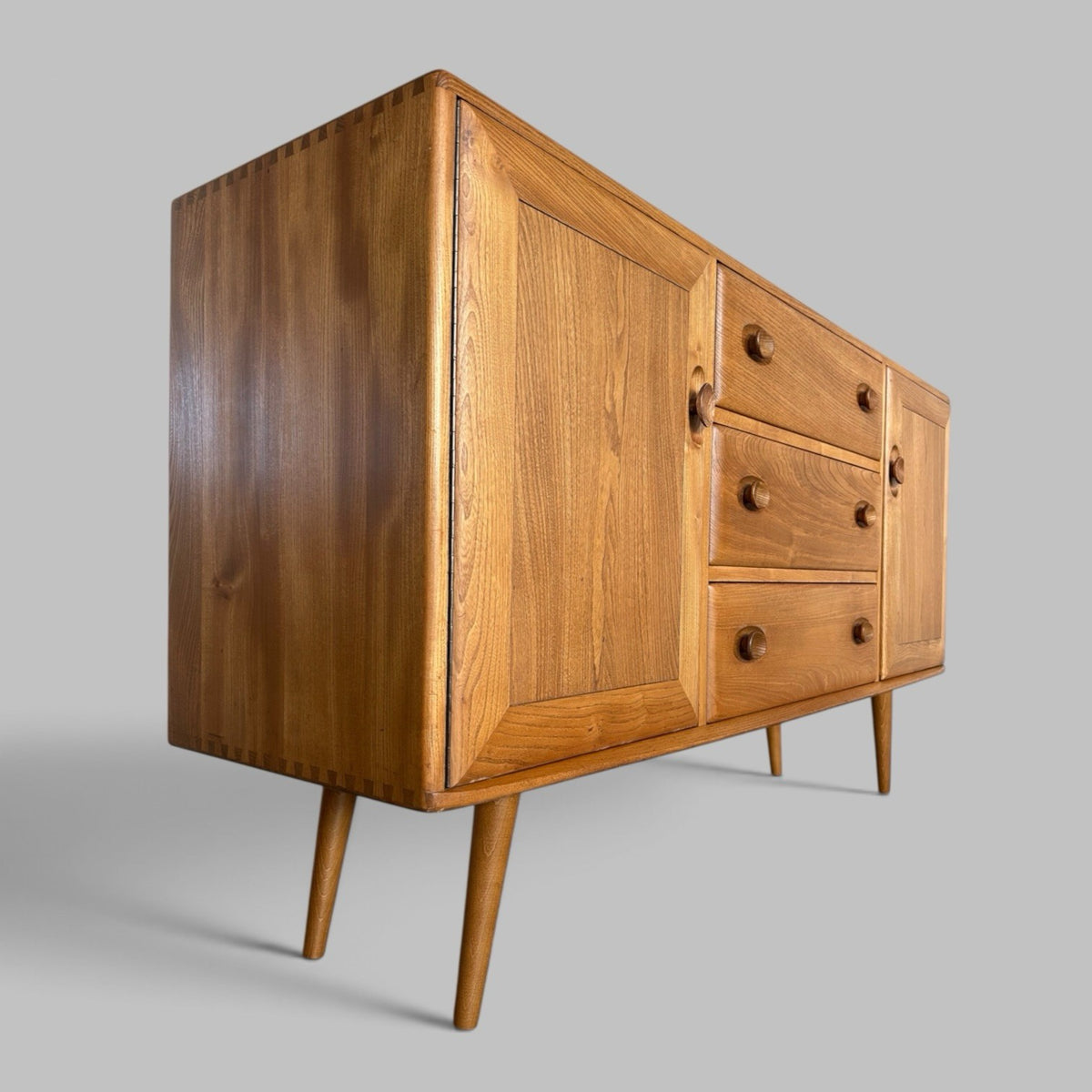 Vintage Ercol Solid Elm Windsor Sideboard on tapered legs.