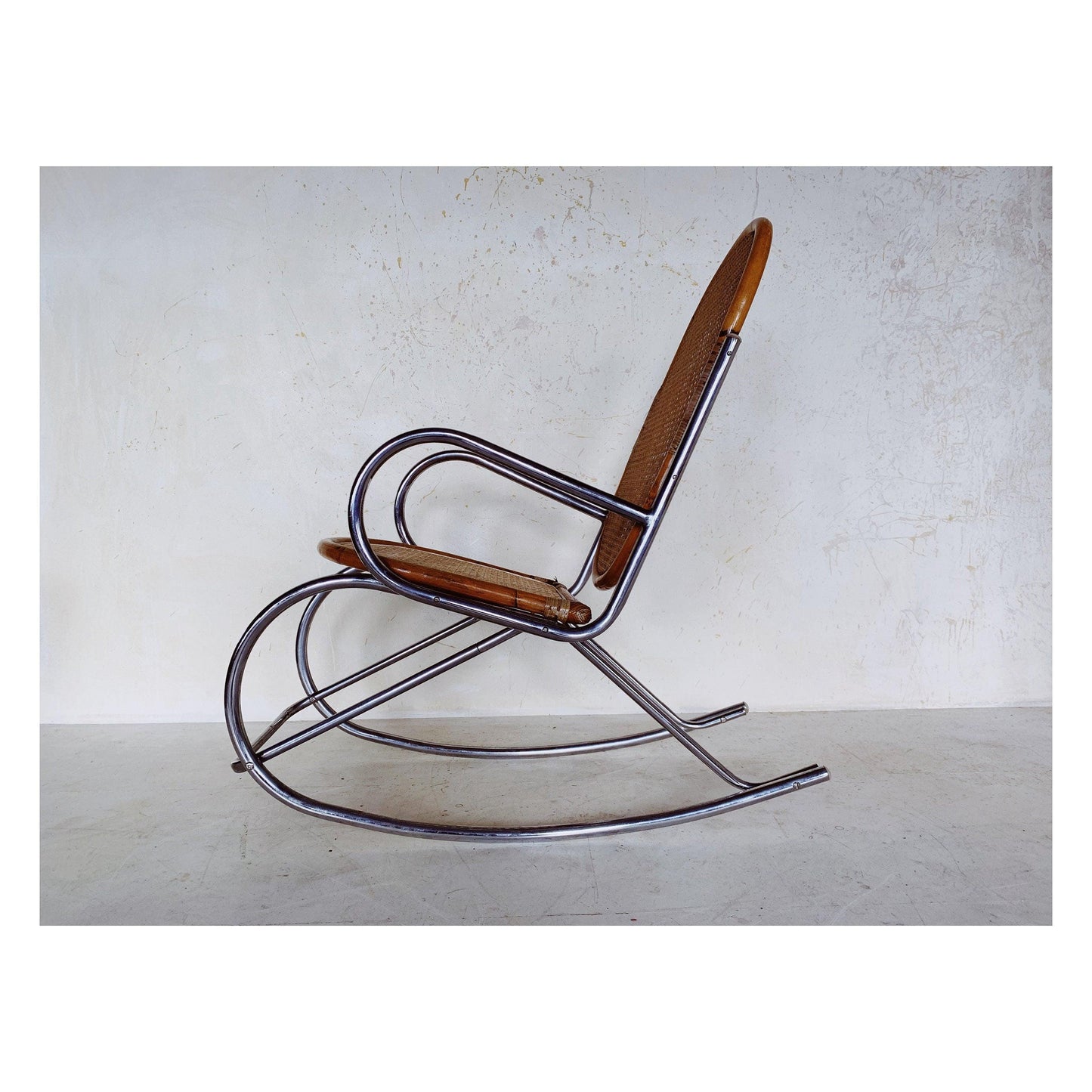 Rattan rocking chair with chrome frame