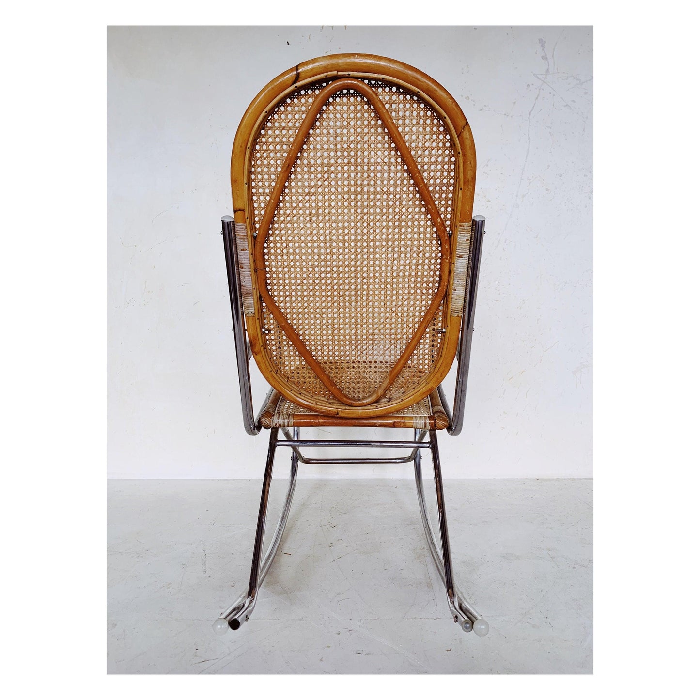 Rattan rocking chair with chrome frame