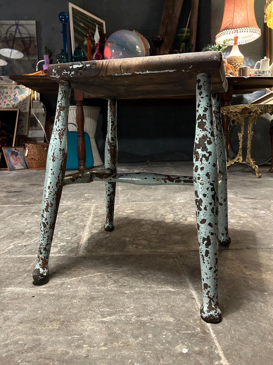 old stool with flakey paint patina