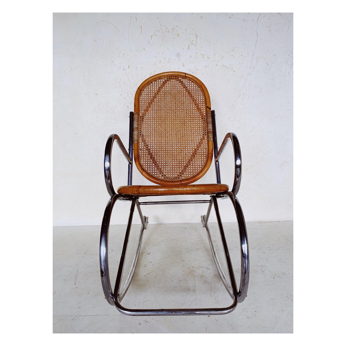 Rattan rocking chair with chrome frame