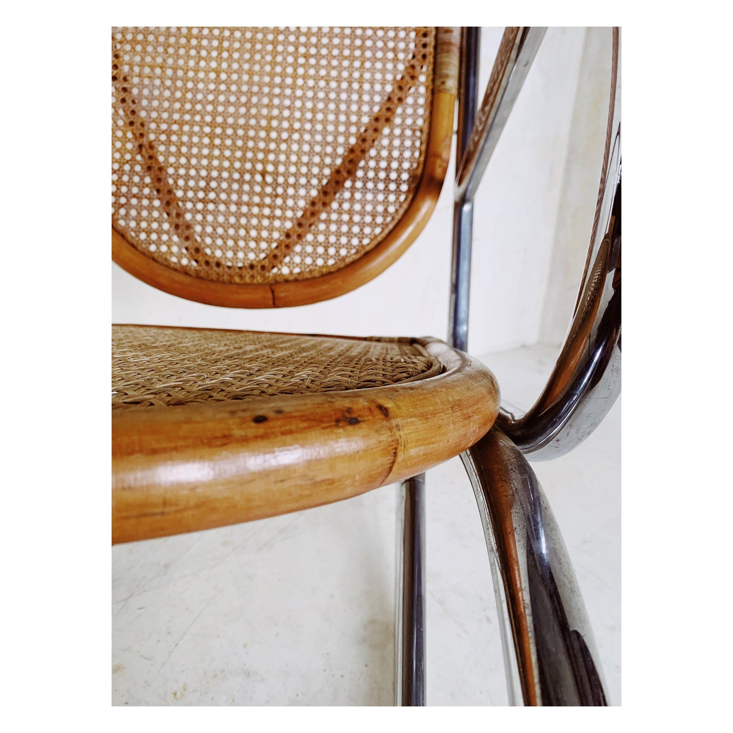 Rattan rocking chair with chrome frame