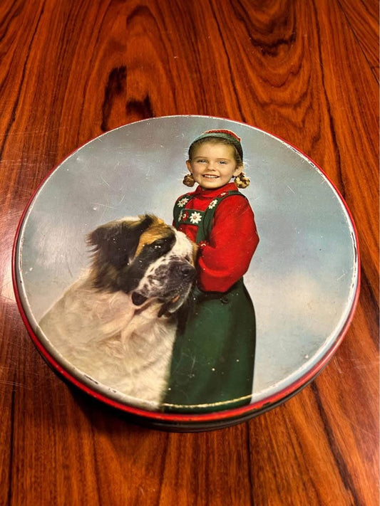 Vintage biscuit tin with kitsch photo of girl with st. Bernard.